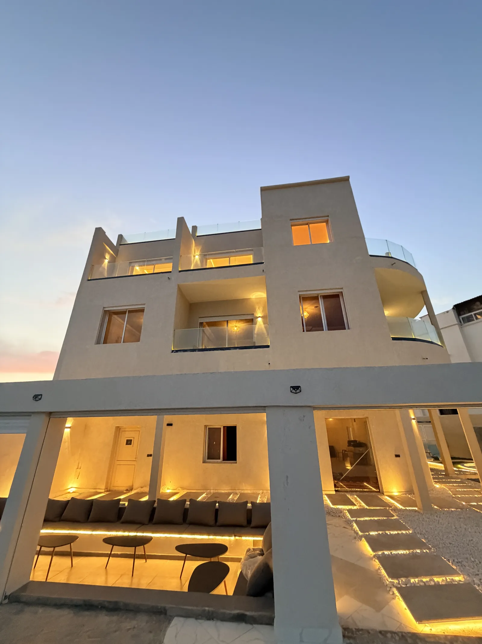 The lodge · lit at dusk
