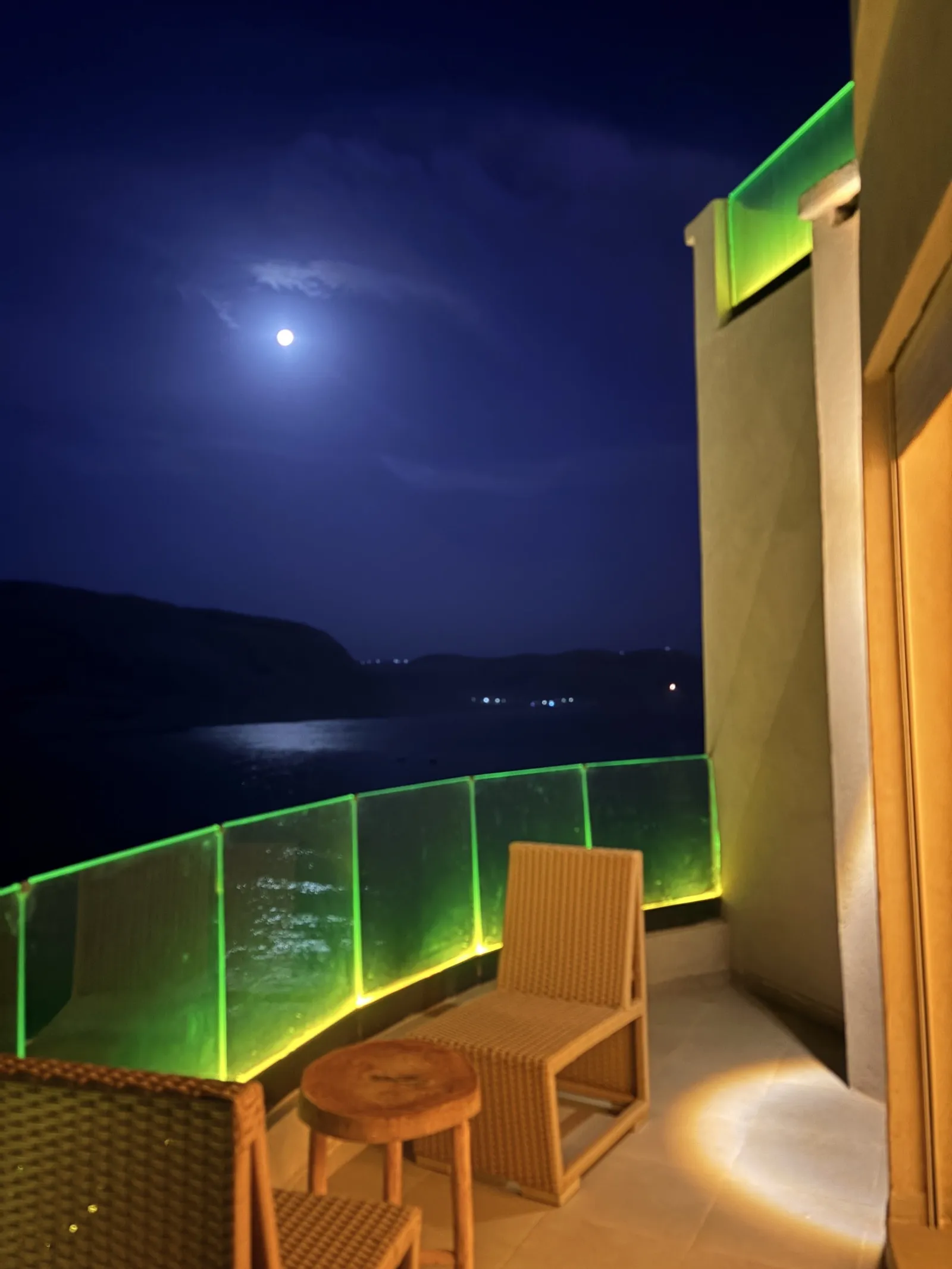 The balcony · moon over the bay